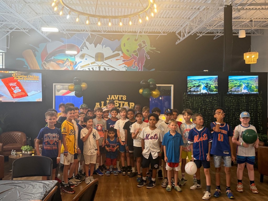 Large group of kids at a baseball-themed birthday party at SWING Middletown