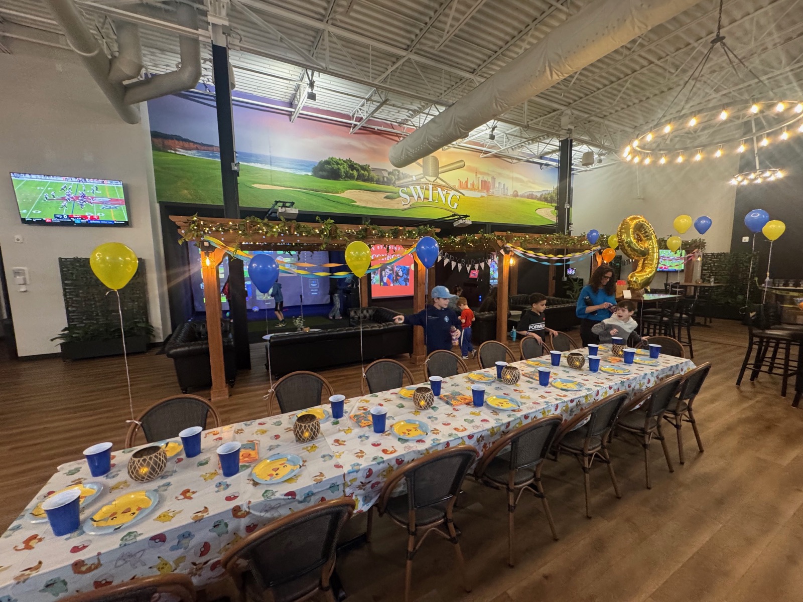 Kids birthday party at SWING Middletown indoor sports venue with batting cages, pickleball, and golf simulators